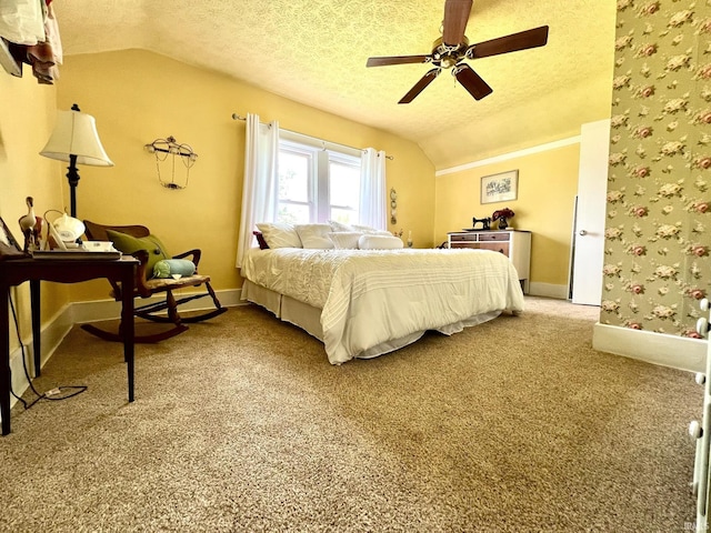 carpeted bedroom featuring baseboards, a ceiling fan, a textured ceiling, and vaulted ceiling