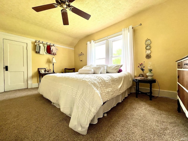 carpeted bedroom with a textured ceiling, ceiling fan, baseboards, and lofted ceiling