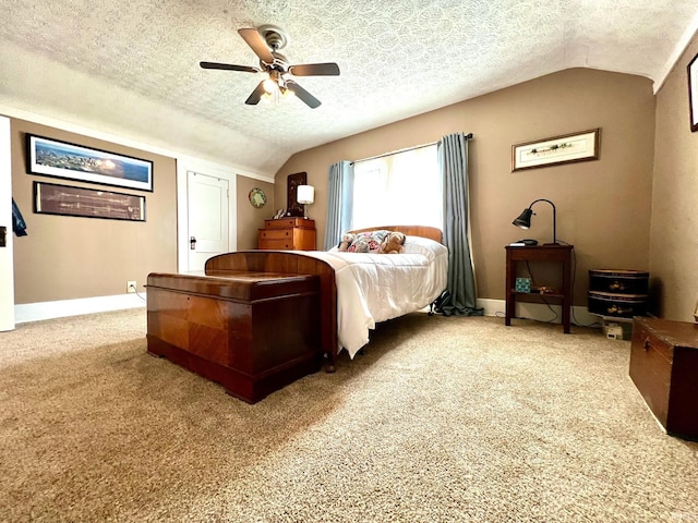 bedroom with ceiling fan, light colored carpet, a textured ceiling, baseboards, and lofted ceiling