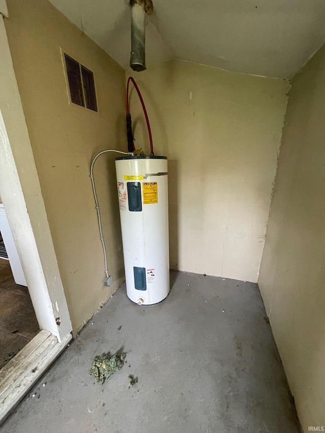 utility room featuring visible vents and water heater