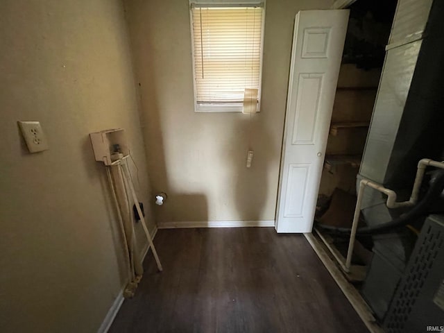 laundry room featuring baseboards, laundry area, washer hookup, and wood finished floors