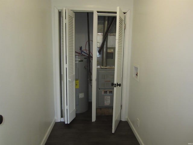 utility room featuring water heater
