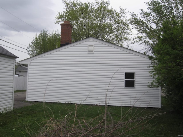 view of side of property featuring a chimney