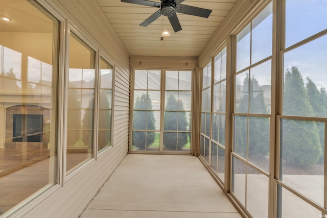 unfurnished sunroom featuring recessed lighting, carpet flooring, and a wealth of natural light