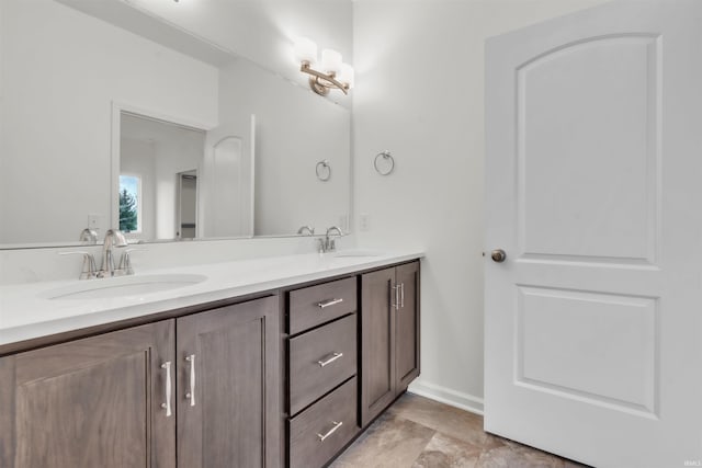 full bathroom featuring a sink and double vanity