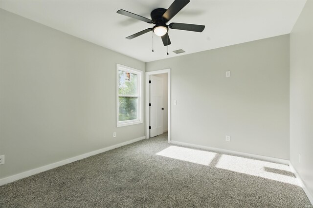 1724 28th St, Bedford, IN 47421 - empty room featuring carpet flooring, ceiling fan, and baseboards