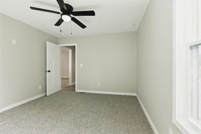 1724 28th St, Bedford, IN 47421 - carpeted empty room featuring ceiling fan and baseboards