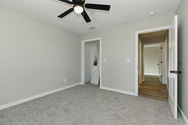 1724 28th St, Bedford, IN 47421 - unfurnished bedroom featuring light carpet, baseboards, and a ceiling fan