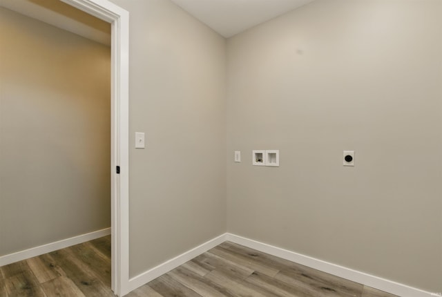 1724 28th St, Bedford, IN 47421 - laundry room featuring electric dryer hookup, hookup for a washing machine, wood finished floors, and baseboards