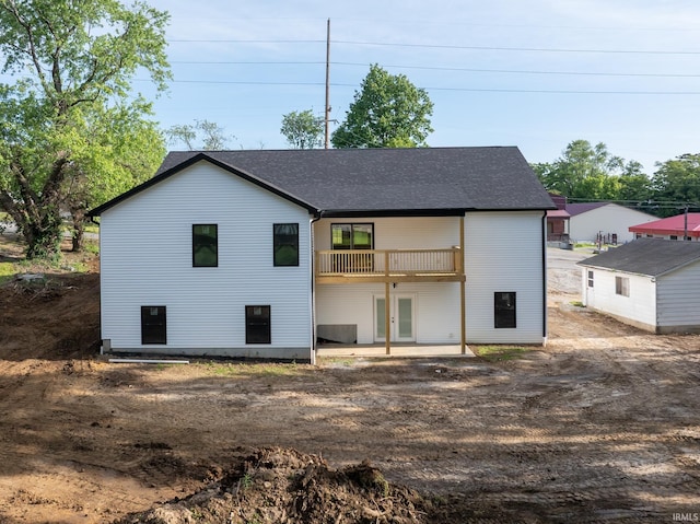 1724 28th St, Bedford, IN 47421 - back of property with roof with shingles, french doors, and a patio