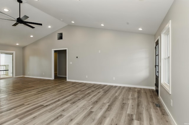 1724 28th St, Bedford, IN 47421 - unfurnished living room featuring a ceiling fan, recessed lighting, light wood-type flooring, high vaulted ceiling, and baseboards