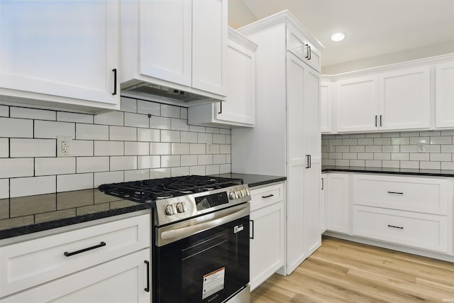 1724 28th St, Bedford, IN 47421 - kitchen featuring stainless steel range with gas stovetop, ventilation hood, white cabinets, and recessed lighting