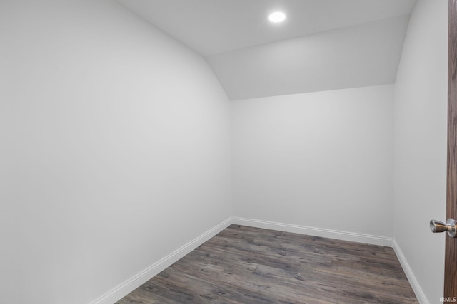 interior space with baseboards, recessed lighting, dark wood finished floors, and lofted ceiling