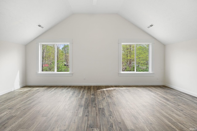 bonus room featuring visible vents, plenty of natural light, and wood finished floors