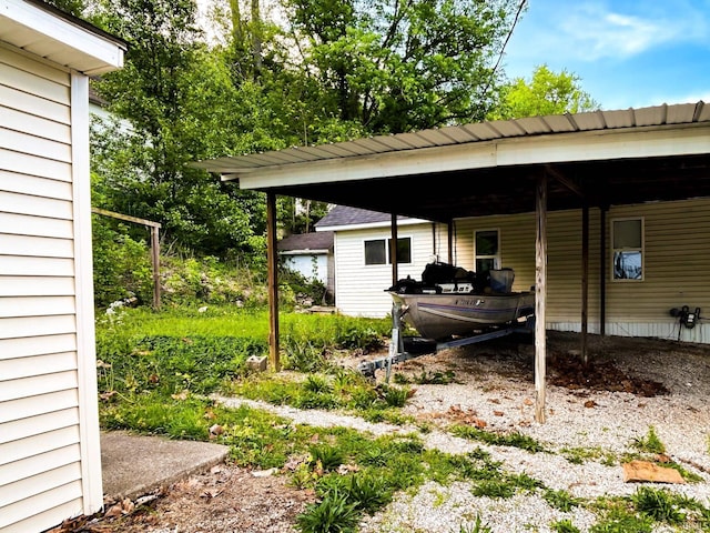 view of patio featuring an attached carport