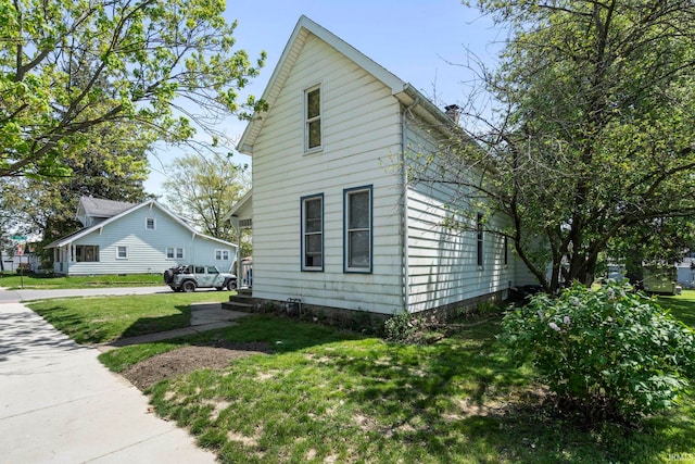 view of home's exterior featuring a lawn