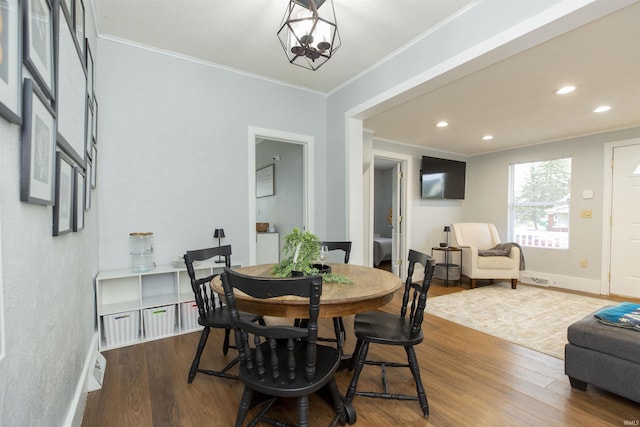 dining room featuring crown molding, recessed lighting, baseboards, and dark wood-style floors