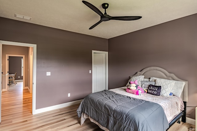 4663 Beringer Dr, Lafayette, IN 47909 - bedroom featuring baseboards, light wood-style floors, visible vents, and a ceiling fan