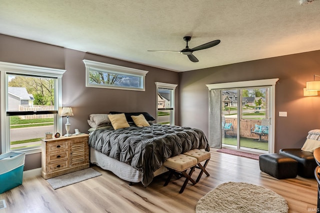 4663 Beringer Dr, Lafayette, IN 47909 - bedroom featuring wood finished floors, multiple windows, and access to exterior