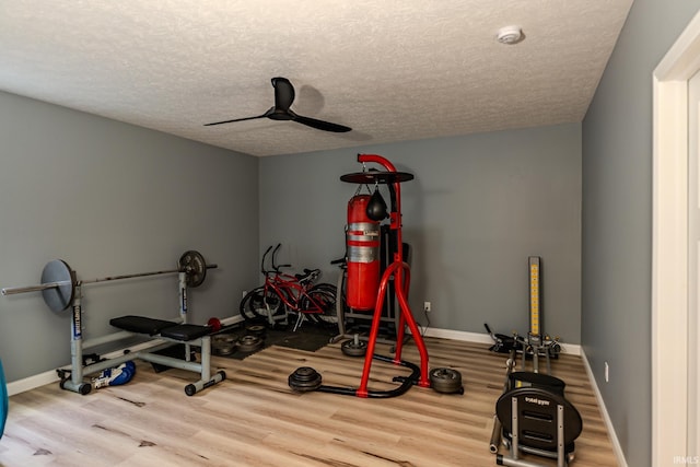 4663 Beringer Dr, Lafayette, IN 47909 - exercise room with baseboards, ceiling fan, a textured ceiling, and wood finished floors