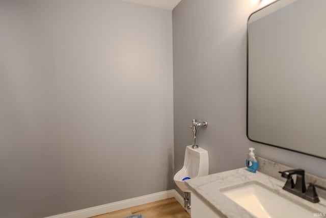 4663 Beringer Dr, Lafayette, IN 47909 - bathroom featuring wood finished floors, baseboards, and vanity
