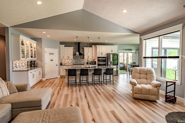 4663 Beringer Dr, Lafayette, IN 47909 - living room with light wood finished floors, vaulted ceiling, baseboards, and recessed lighting