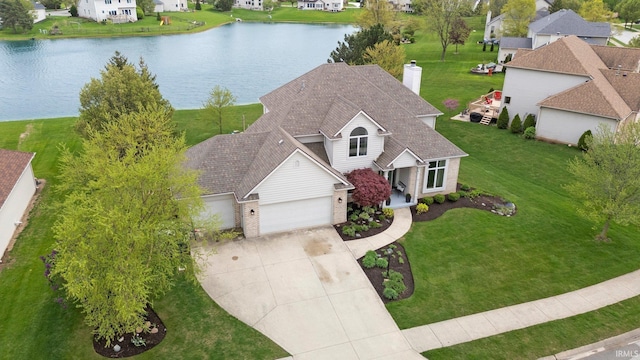 bird's eye view featuring a water view and a residential view