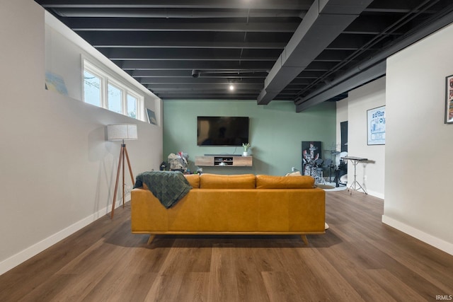 living room with baseboards and wood finished floors