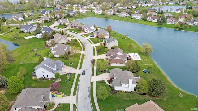 birds eye view of property with a residential view and a water view