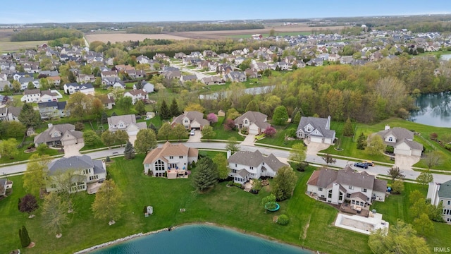bird's eye view featuring a water view and a residential view