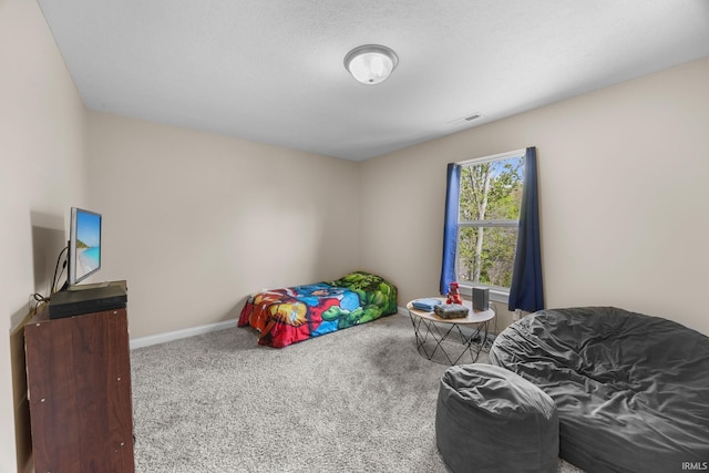 bedroom featuring carpet floors, baseboards, and visible vents