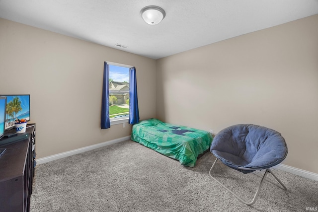 carpeted bedroom with baseboards and visible vents