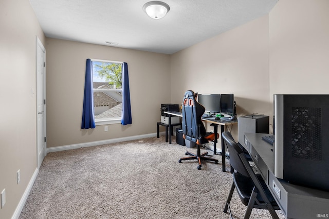home office with baseboards, carpet flooring, and visible vents