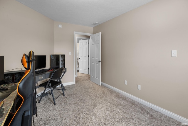 carpeted office featuring baseboards and visible vents