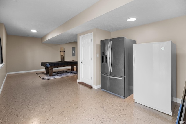 kitchen with freestanding refrigerator, baseboards, stainless steel refrigerator with ice dispenser, speckled floor, and billiards