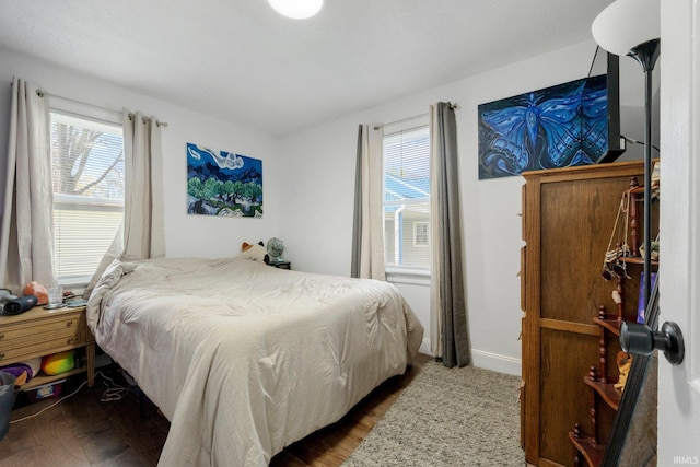 2819 Witchwood Dr, Fort Wayne, IN 46809 - bedroom with multiple windows and dark wood-style floors
