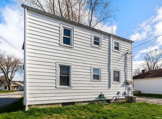 2819 Witchwood Dr, Fort Wayne, IN 46809 - view of home's exterior with a lawn and central AC unit