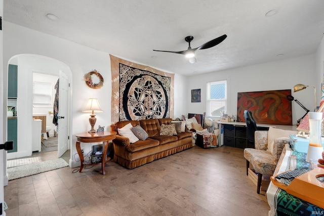 2819 Witchwood Dr, Fort Wayne, IN 46809 - living room featuring arched walkways, ceiling fan, and wood-type flooring