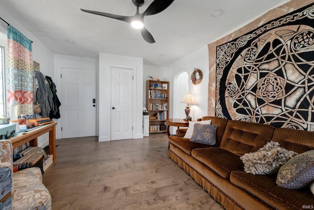2819 Witchwood Dr, Fort Wayne, IN 46809 - living area with arched walkways, ceiling fan, and wood finished floors