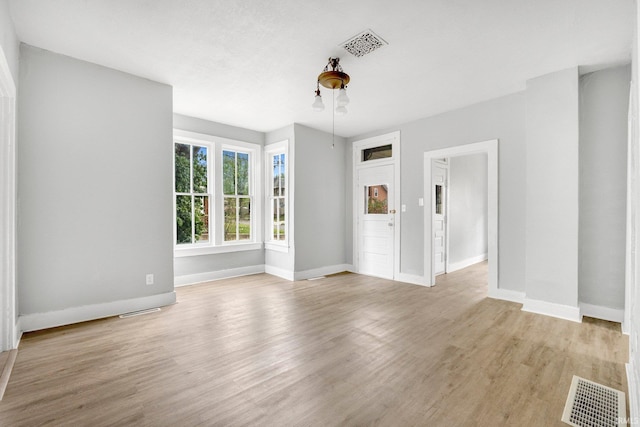 interior space featuring visible vents and light wood-style flooring