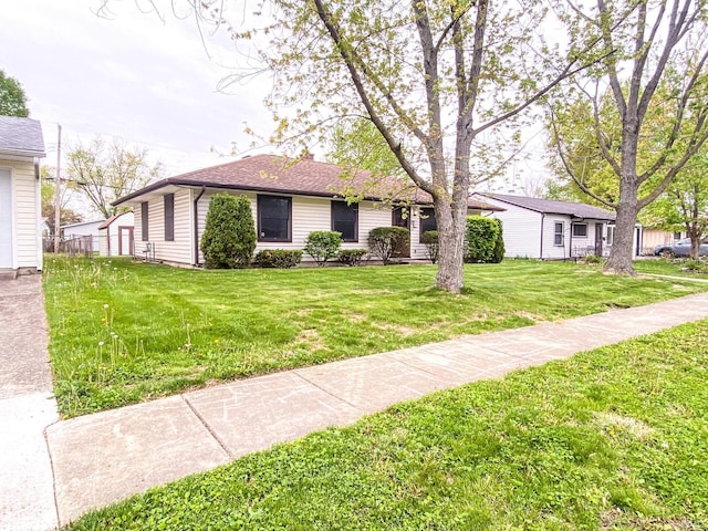 ranch-style home featuring a front yard