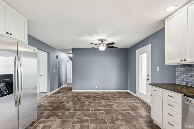 kitchen with baseboards, a ceiling fan, white cabinetry, and appliances with stainless steel finishes