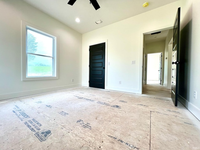 unfurnished bedroom with baseboards and a ceiling fan