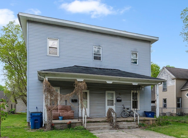 traditional-style home with fence and covered porch