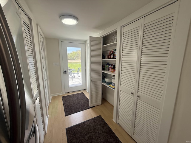 doorway with light wood-style floors