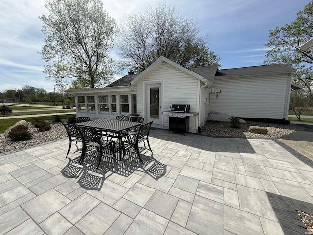 view of patio featuring area for grilling and outdoor dining space