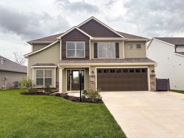 craftsman inspired home with driveway, a front lawn, roof with shingles, and a garage