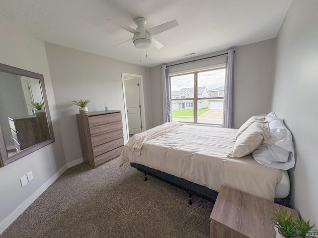 carpeted bedroom with baseboards, visible vents, and ceiling fan