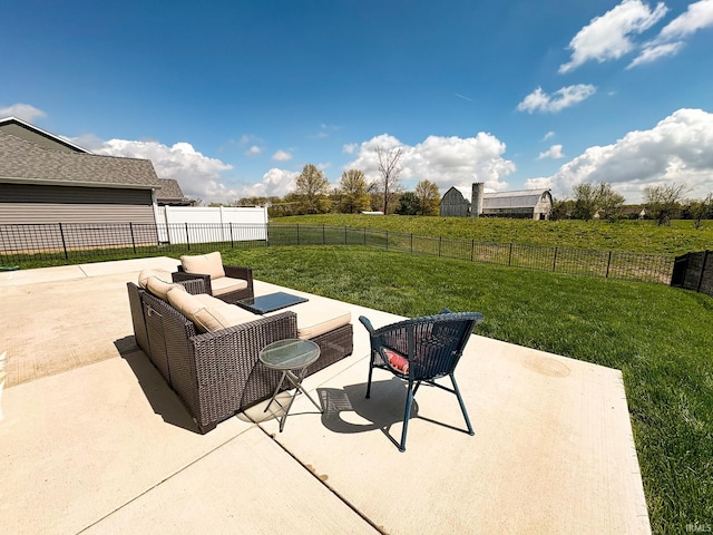 view of patio / terrace featuring a rural view, an outdoor hangout area, and a fenced backyard