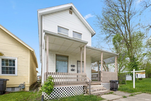 view of front facade featuring a porch and a front yard